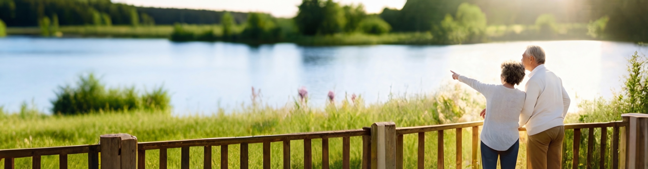 给湖面增加一些蓝色调，给前景和岸边的绿植适当增加更多绿色，让整体色调更清新自然，保留原图中两位老人的姿势、构图和整体光影氛围不变预览效果