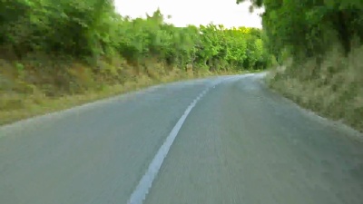 沿乡村道路行驶在林线之间的时间间隔股票视频