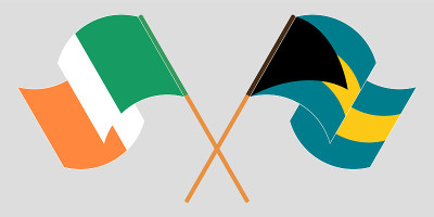 Crossed and waving flags of Bahamas and Ireland