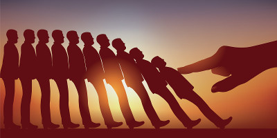 Concept of the domino effect with men stoked in a 