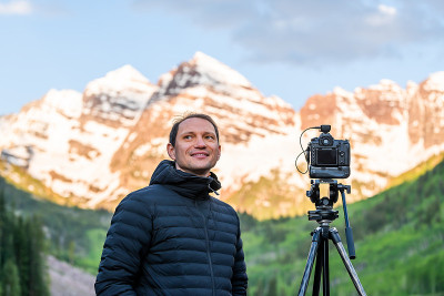 Maroon Bells lake peak at sunrise with happy man p