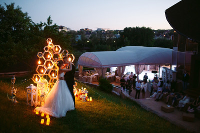 Evening wedding ceremony. The bride and Groom are 