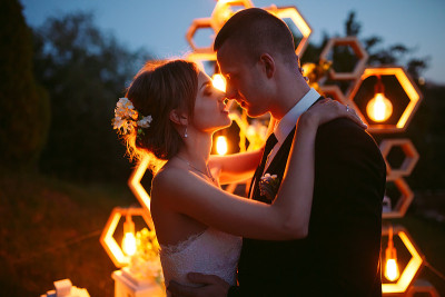 Evening wedding ceremony. The bride and Groom are 