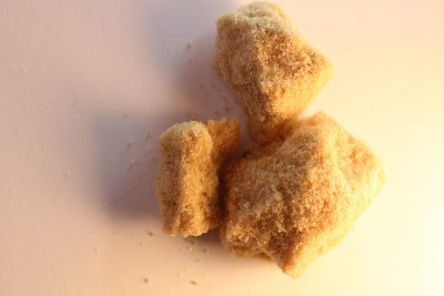 Clumps of brown sugar. Brown sugar is simply a mus