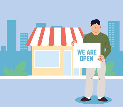 man at his local business with open banner