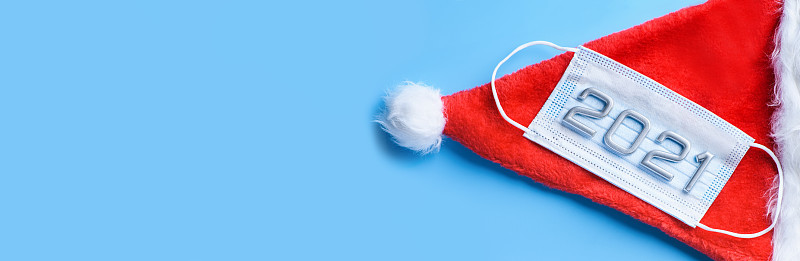 Medical mask and numbers 2021 with a red Christmas