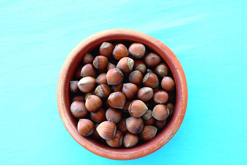 Hazelnuts in a bowl, top view