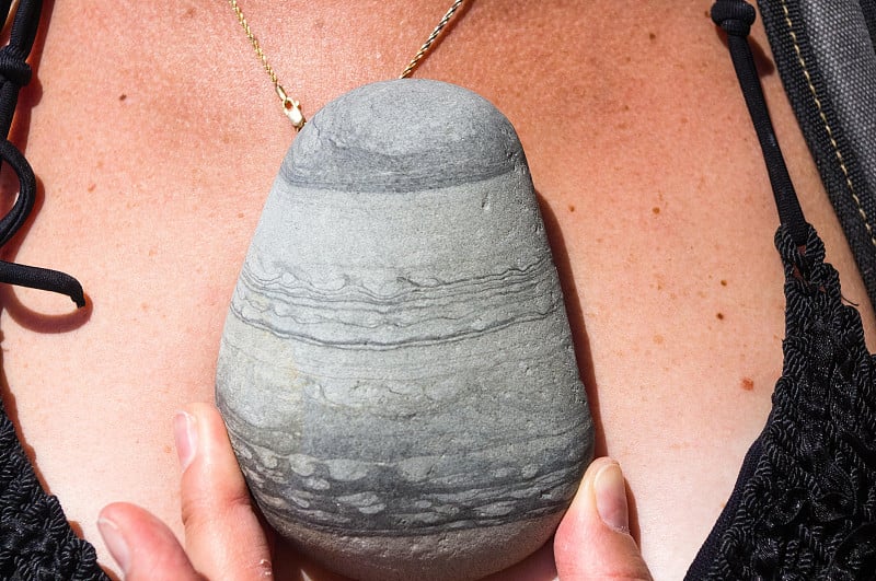 beautiful beach stone in a female hand