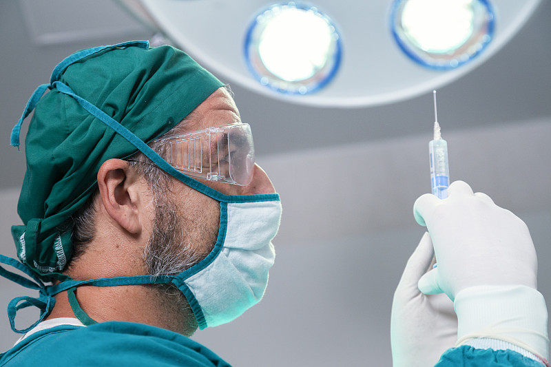 doctor holding general anesthetic medicine or anti