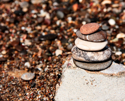 Pyramid of sea stones. Sea tour. Pebbles of the se