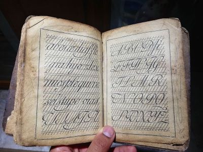 Old book with cross in house