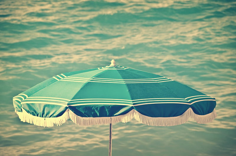 Beach umbrella, sea background