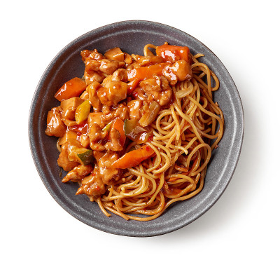 bowl of fried noodles and sweet and sour pork isol