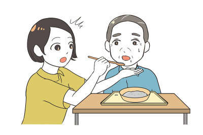 帮助年长的男性女性看护者打翻食物