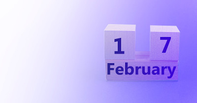 木制的立方体日历为2月17日，紫色渐变背景与空白的文字