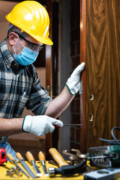 Carpenter at work protects the face with the surgi