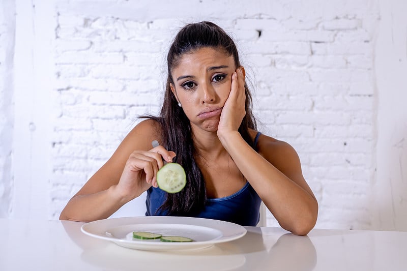 Portrait o f young attractive woman feeling sad an