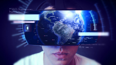 帅气的年轻人戴着VR头戴体验虚拟现实。