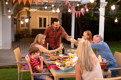 Happy Caucasian family eating together at table