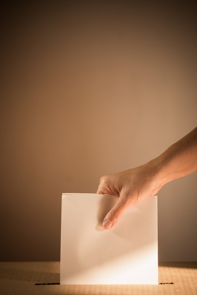 Conceptual image of a person voting during electio