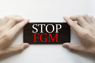 male hands are holding black phone with text Stop 