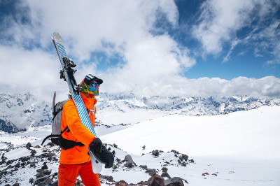 Portrait of a stern climber skier in sunglasses an