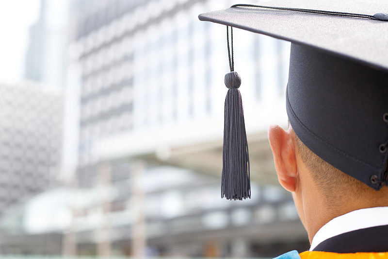 Graduates receive a certificate at the university