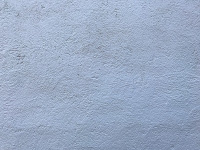 White stipple effect wall in grey color texture ba