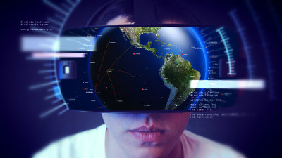 帅气的年轻人戴着VR头戴体验虚拟现实。