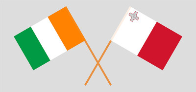 Crossed flags of Malta and Republic of Ivory Coast