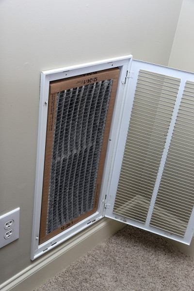 Replacing dirty air filter for air conditioner sys
