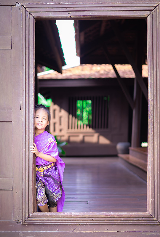 little asian girl in Thai period dress standing in