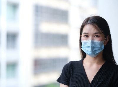 single female wearing mask during covid 19