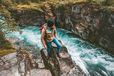 Adventurer man hiking alone active lifestyle extre