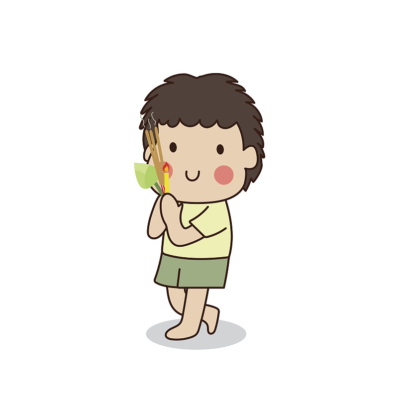 佛教男孩手拿点燃的蜡烛走在寺庙周围。