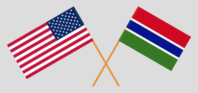 Crossed flags of the USA and the Gambia