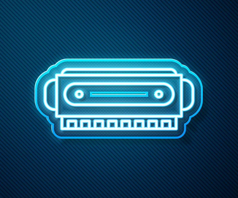 Glowing neon line Harmonica icon isolated on blue 