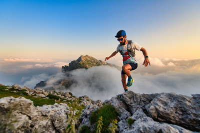 Man ultramarathon runner in the mountains he train