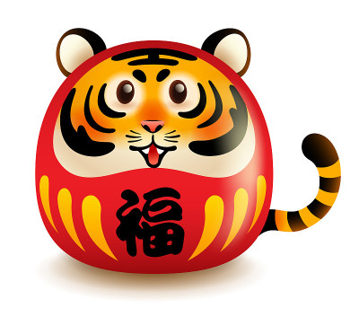日本的老虎脸达摩娃娃。孤立。翻译:好运。