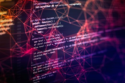 笔记本特写照片。CSS, JavaScript和HTML的使用。监控功能源代码的特写。摘要IT技术背