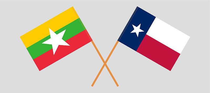 Crossed flags of the State of Texas and Myanmar