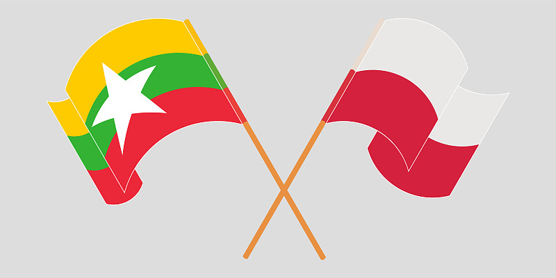 Crossed and waving flags of Myanmar and Poland