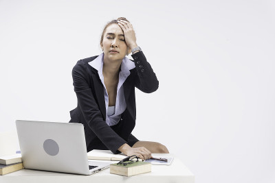 Business woman sit in office. Using a computer lap