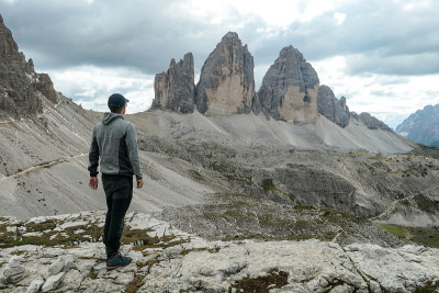 A man in hiking outfit enjoying the view on the fa
