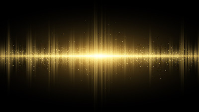 在黑暗的背景上发出金色的声波。光的效果。收音机，俱乐部，派对的背景。光的振动。带有发光尘埃的明亮闪光