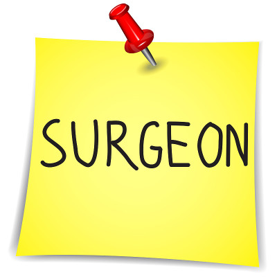 Surgeon on a Note Paper with pin on white