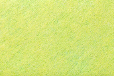 浅绿色无光麂皮织物特写。毛毡的天鹅绒质地。