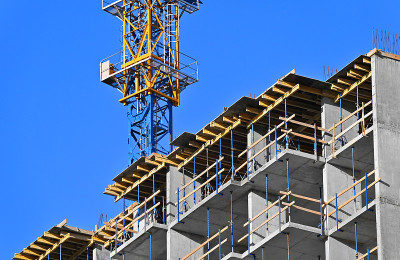 Crane and highrise construction site
