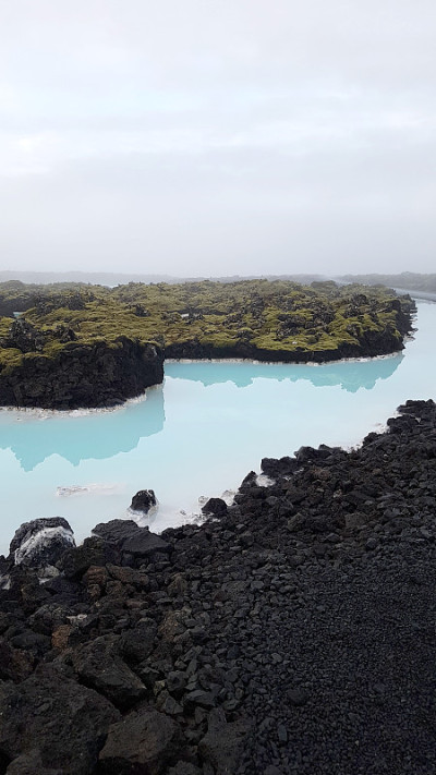 Blue Hot Spring River and Black Volcanic stone