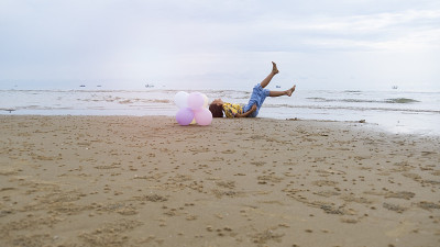 Asian young girl enjoy time playing balloone at th